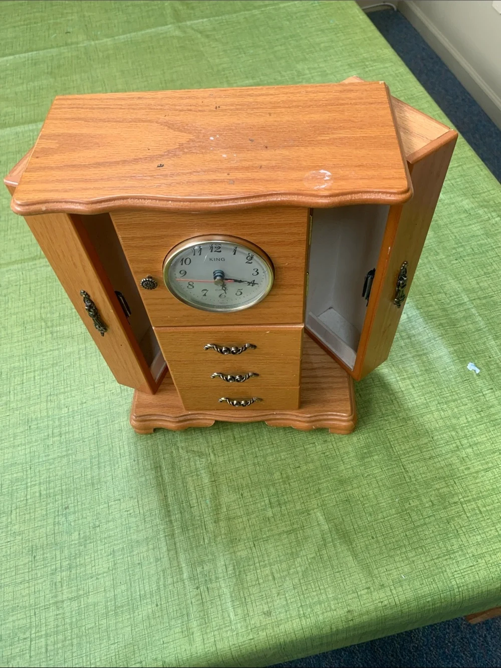 Wood-Tone Jewelry Cabinet Wall Clock with Built-In Clock